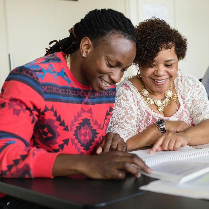 Two counseling students working on assignment in class